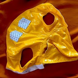 Yellow and polka dotted rain jacket